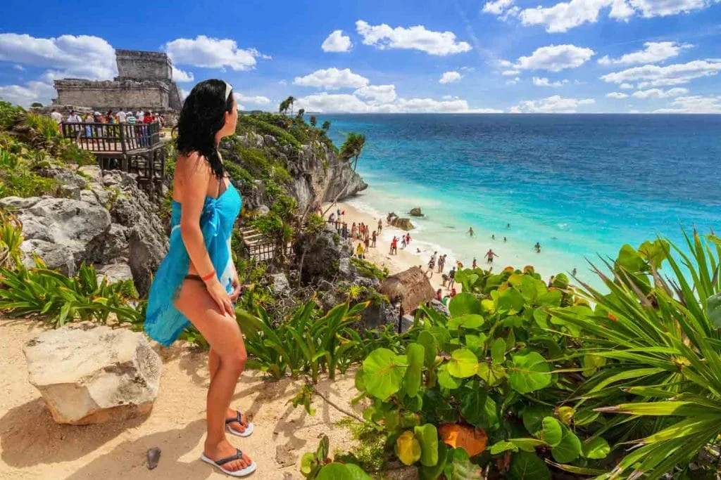 Woman at beautiful Tulum beach 1024x683