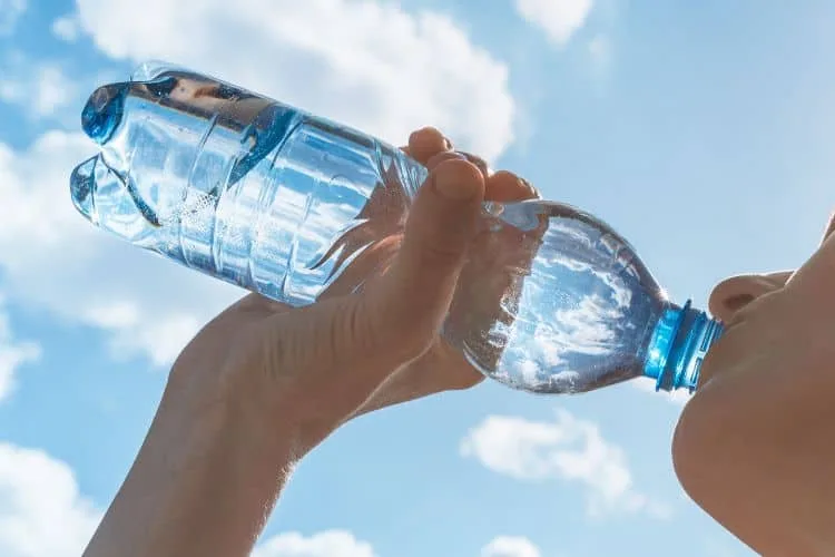 Woman drinking bottled water