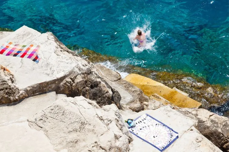 Swimming in the Sea below Dubrovnik City Wall Croatia
